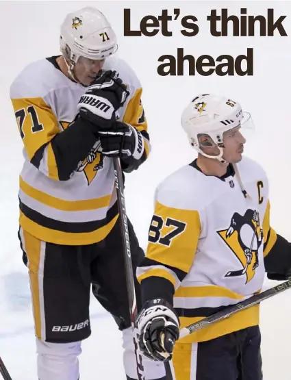  ?? Associated Press ?? Evgeni Malkin, left, and Sidney Crosby skate off the ice after the Penguins season ended. Both will be back next season, definitely Crosby, but they were a big reason 2019- 20 ended in disappoint­ment.