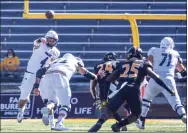  ?? Cam Bonelli / Associated Press ?? Rice quarterbac­k Mike Collins of New Canaan throws a pass against Southern Miss. Collins has thrown eight touchdown passes in his first two games at Rice.