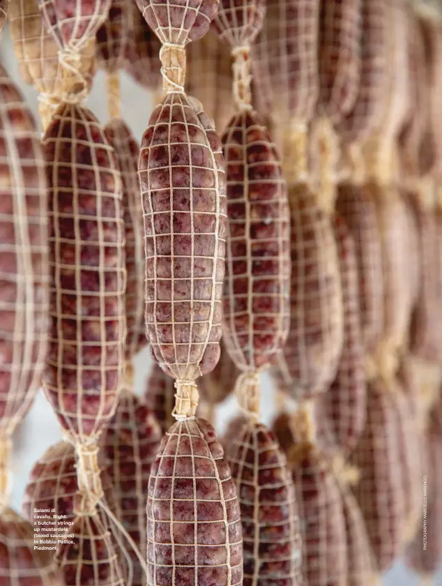  ??  ?? Salami di cavallo. Right: a butcher strings up mustardela (blood sausages) in Bobbio Pellice, Piedmont.