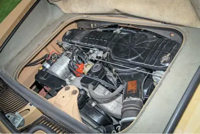  ??  ?? The standard twin- carb 1584cc 'suitcase' engine is still the original unit for this car and has recorded just over 50,000 miles. New valves and clutch were fitted in 2008. Note the shallow luggage space above it.