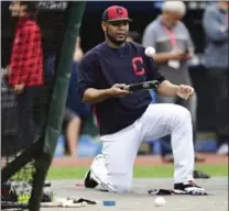  ?? DAVID DERMER, THE ASSOCIATED PRESS ?? Indians’ Edwin Encarnacio­n balances the ball on his bat as he waits to take batting practice during a team workout Tuesday in Cleveland. The Indians will play the New York Yankees on Wednesday in Game 5 of the ALDS.