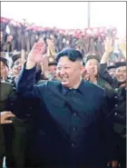  ?? KCNA VIA KNS/AFP ?? North Korean leader Kim Jong-un (centre) celebrates the successful test-fire of the interconti­nental ballistic missile Hwasong-14 at an undisclose­d location in 2017.