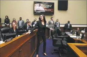  ?? Mark Wilson / Getty Images ?? U.S. Rep. Alexandria Ocasio-Cortez, D-N.Y., talks with fellow members during a House Oversight and Reform Committee hearing on Thursday in Washington, D.C.