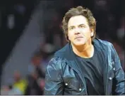  ?? Paul Sancya Associated Press ?? ACTIVISTS want Tom Gores to sell the Detroit Pistons unless he unloads a prison telephone company.