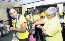  ?? FILE ?? Sunshine Girl Nichala Gibson (left) with former Jamaica Netball Associatio­n president, Marva Bernard (right) in 2009. In the background are other members of the Sunshine Girls squad.