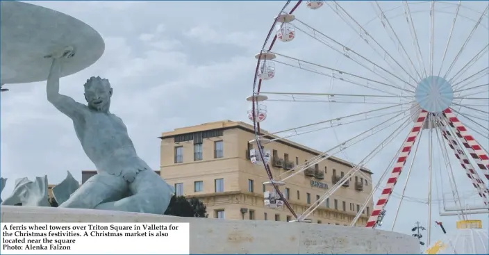  ??  ?? A ferris wheel towers over Triton Square in Valletta for the Christmas festivitie­s. A Christmas market is also located near the square
Photo: Alenka Falzon