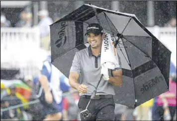  ?? PHELAN M. EBENHACK / AP ?? Leader Jason Day stayed upbeat despite poor weather at the Arnold Palmer Invitation­al. Kevin Chappell, Troy Merritt and Henrik Stenson are two shots back.