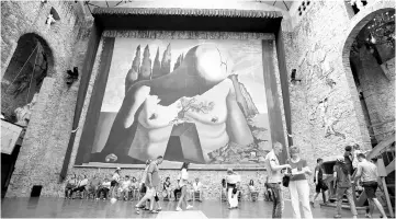  ??  ?? File photo shows people walk around Salvador Dali’s tomb inside the Teatre-Museu Dali in Figueres, north of Barcelona, Spain. — Reuters photo