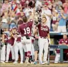  ?? Sean M. Haffey / Getty Images ?? Logan Tanner of Mississipp­i State celebrates with his team after hitting a solo home run.