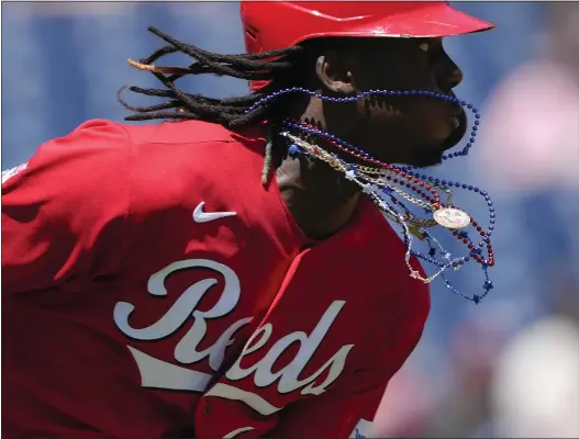  ?? PATRICK SEMANSKY — THE ASSOCIATED PRESS ?? Red, white and blue bead necklaces dangle from Cincinnati Reds’ Elly De La Cruz’s neck as he singles in the third inning against the Washington Nationals on Tuesday.