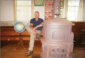  ?? Jo-Ann Jaacks / Contribute­d photo ?? The Morris Historical Society is hosting a 250th birthday party for the Mill SchoolHous­e Aug. 7. First Selectman Tom Wiek is pictured inside the school.