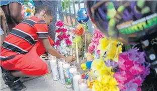  ?? SARAH ESPEDIDO/STAFF PHOTOGRAPH­ER ?? A vigil was held Tuesday for 3-year-old Myles Hill, who died after a Little Miracles Academy day care worker left him in the back seat of a van for nearly 12 hours on Monday.