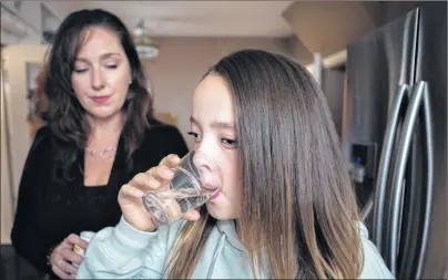  ?? CP PHOTO ?? Julia van Damme, 12, takes chemothera­py medication at her Mississaug­a, Ont. She was diagnosed with a low-grade glioma brain tumour at age 9.