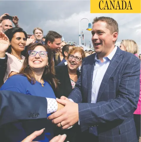 ?? CHRISTINNE MUSCHI / REUTERS ?? Conservati­ve party Leader Andrew Scheer greets supporters as he launches his election campaign in Trois-Rivières, Que., on Wednesday.