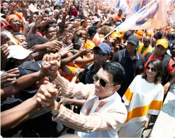  ??  ?? Rajoelina greets his supporters during a campaign rally at the Coliseum stadium in Antananari­vo. — Reuters photos