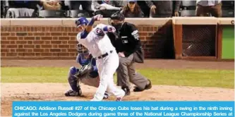  ?? —AFP ?? CHICAGO: Addison Russell #27 of the Chicago Cubs loses his bat during a swing in the ninth inning against the Los Angeles Dodgers during game three of the National League Championsh­ip Series at Wrigley Field.