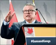  ?? CP PHOTO JUSTIN TANG ?? Minister of Public Safety and Emergency Preparedne­ss Ralph Goodale speaks during a press conference at the Summit on Gun and Gang Violence in Ottawa on Wednesday.