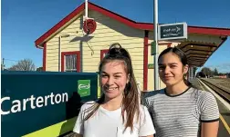  ??  ?? University students and Wairarapa commuters Anna Rossiter-stead and Ngahuia Huirama at the Carterton train station.