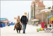  ?? Gary Coronado Los Angeles Times ?? FOR THOSE who need a break from the music festivitie­s, pony rides on the beach are another option.
