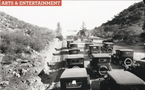  ?? C.C. Pierce Co. 1924 / California Historical Society Collection­s at the University of Southern California ?? “Automobile­s Clustered at the Opening of the Mulholland Highway” is a gelatin silver print of a nearly century-old traffic jam in Los Angeles.