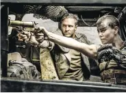  ??  ?? Left: Tom Hardy, who is up for best supporting actor for his role in The Revenant, and Charlize Theron star in best picture contender Mad Max: Fury Road.