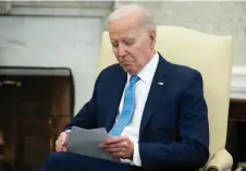  ?? — AFP photo ?? Biden looks on during a meeting with Italian Prime Minister Giorgia Meloni in the Oval Office of the White House in Washington, DC.