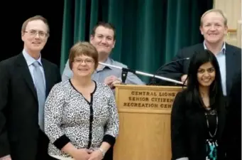  ??  ?? Dr. Adrian Wagg (far right) with the Dare to Age Well team at a health education seminar. Photo: Division of Geriatric Medicine, University of Alberta