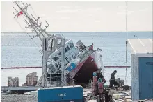  ?? ANDREW VAUGHAN THE CANADIAN PRESS ?? A Canadian Coast Guard vessel containing diesel and hydraulic fuel was cut from its cradle at a Nova Scotia shipyard and is partially submerged.