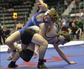  ??  ?? Saratoga Springs junior Eric Friskowitz looks for a way to untangle and turn Niskayuna’s Willie Thacker late in their 138-pound Section 2 Division 1 semifinal match at the Cool Insuring Arena. Thakcer advanced to the final with a 5-1 win.