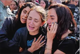  ?? BILAL HUSSEIN/AP PHOTO ?? Relatives of Reuters videograph­er Issam Abdallah who was killed by Israeli shelling mourn during his funeral procession in his hometown of Khiam, southern Lebanon, on Saturday. Abdallah was killed Friday, when an Israeli shell landed in a gathering of internatio­nal journalist­s covering clashes on the border in south Lebanon. Six other journalist­s were injured in the incident.