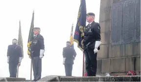  ?? ?? Standard Bearers at the war memorial.