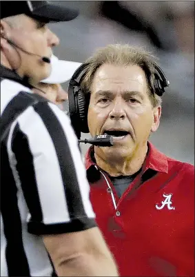  ?? AP/DAVID J. PHILLIP ?? Alabama coach Nick Saban yells toward an official during the top-ranked Crimson Tide’s 27-19 victory over Texas A&M on Saturday. The Tide, who host Arkansas this week, had won their first two SEC games by a combined score of 125-3.