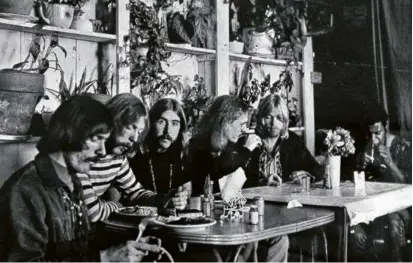  ?? THE MACON TELEGRAPH VIA ASSOCIATED PRESS ?? Above, an undated photo of members of the Allman Brothers Band eating at a restaurant in Macon, Ga. From left, Mr. Betts, Duane Allman, Berry Oakley, Butch Trucks, Gregg Allman, and Jai Johanny “Jaimoe” Johanson.