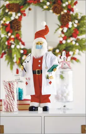  ?? RAZ IMPORTS ?? For those wanting a keepsake of what 2020has been, Raz Imports offers a unique collection that includes a masked Santa doctor.