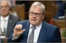  ?? The Canadian Press ?? Veterans Affairs and Associate Minister of National Defence Minister Lawrence MacAulay responds to a question during Question Period in the House of Commons Tuesday.