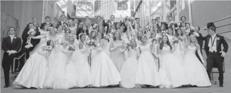  ?? Peterson, Special to The Denver Post Photos by Steve ?? Le Bal de Ballet chair Kari Stewart, center, the 2018 debutantes, and Young Men of Distinctio­n mug for a group photo.