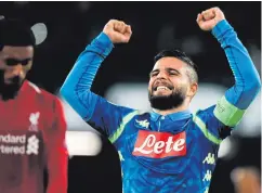  ??  ?? Late show: Napoli ace Lorenzo Insigne celebrates after striking in the final minute to condemn Liverpool to defeat