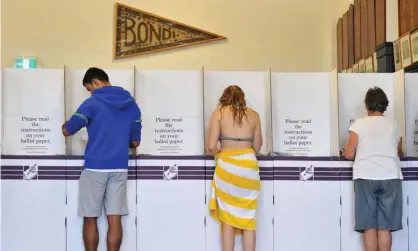  ?? Photograph: Paul Miller/AAP ?? Residents cast their vote at Bondi Surf Bathers Life Saving Club at the 2013 federal election.