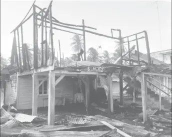  ??  ?? The burnt out remains of the house which was destroyed by the fire on Monday night