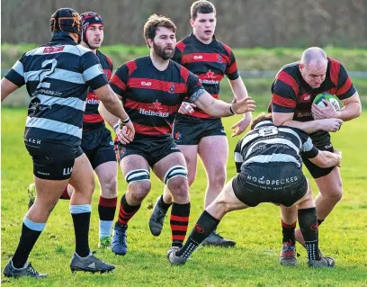  ?? Ian Moss ?? ● Sam Bryan on the charge for Widnes against Broughton Park