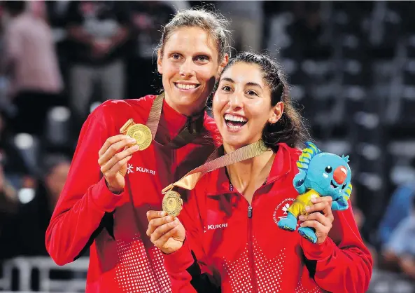  ?? WILLIAM WEST/AFP/GETTY IMAGES ?? Canada’s Sarah Pavan, left, and Melissa Humana-Paredes won gold in women’s beach volleyball at the 2018 Gold Coast Commonweal­th Games Thursday.