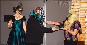  ?? PHOTO SUBMITTED ?? After two competitor­s tied for the costume contest, a friendship was forged when the masked gentleman offered the plaque to his mysterious co-contestant.