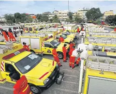  ?? SEKSAN ROJJANAMET­AKUN ?? Thirty-five reconditio­ned fire engines are readied for service while other similar vehicles await repair amid a dispute between City Hall and a storage firm.