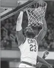  ?? PHIL LONG/AP PHOTO ?? Cleveland’s LeBron James scored in double figures Friday for the 867th straight game.