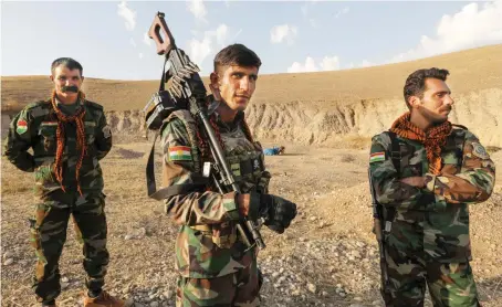  ?? AFP ?? Kurdish Peshmerga fighters, affiliated with the Kurdistan Freedom Party, man a position north of Kirkuk in Iraq’s autonomous Kurdistan region.