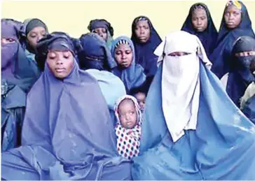  ?? BOKO HARAM/AFP ?? A screengrab of a video released by Boko Haram on January 15 shows some of the schoolgirl­s abducted from the northeast Nigerian town of Chibok in April 2014.
