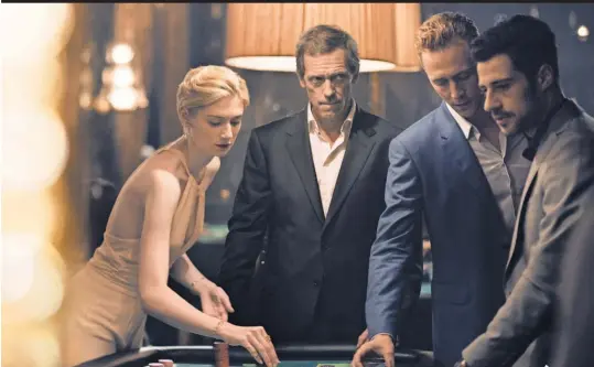  ?? PHOTOS BY DES WILLIE, THE INK FACTORY/ AMC ?? Elizabeth Debicki, Hugh Laurie, Tom Hiddleston, David Avery and Olivia Colman, left, join the spy game.