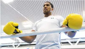  ?? Picture / AP ?? Englishman Anthony Joshua has a habit of turning up late for press conference, says Joseph Parker.