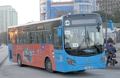  ?? AFP ?? This photo taken on August 18, 2016 shows a Dart (Dar Rapid Transit) bus driving in a street of Dar es Salaam.