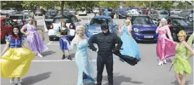  ??  ?? The princesses and Batman ready to go on their tour of Woodley